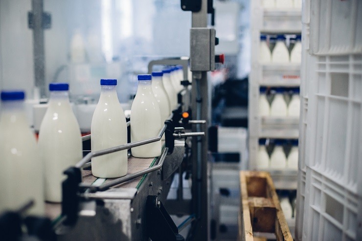 selective-focus-shot-of-complete-milk-bottling-line-in-a-factory