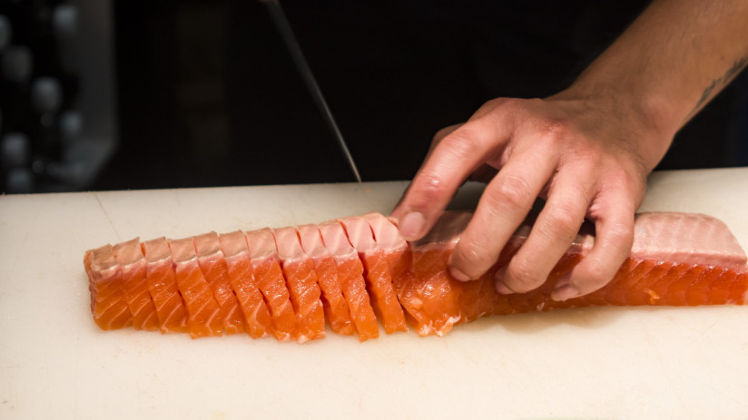 close-up-person-preparing-food-cutting-board