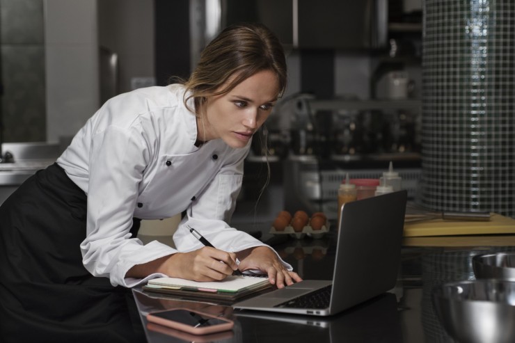female-chef-kitchen-using-laptop-device (2)